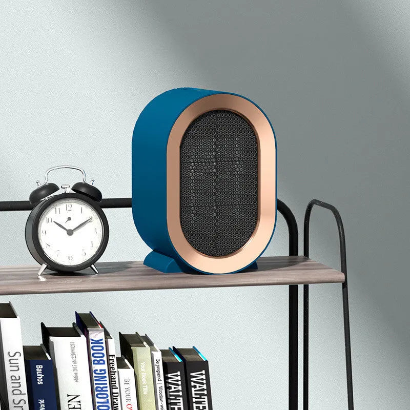 Desktop electric ceramic heater in various colours with mechanical controls and compact portable design
