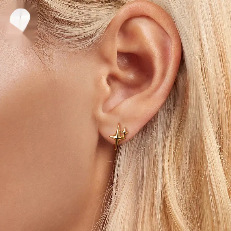 Sterling silver star ear clips with oxidised finish and clip-on mechanism