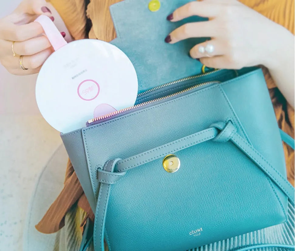 A slim, portable UV baby bottle steriliser in blue, showing its compact size and USB charging port.