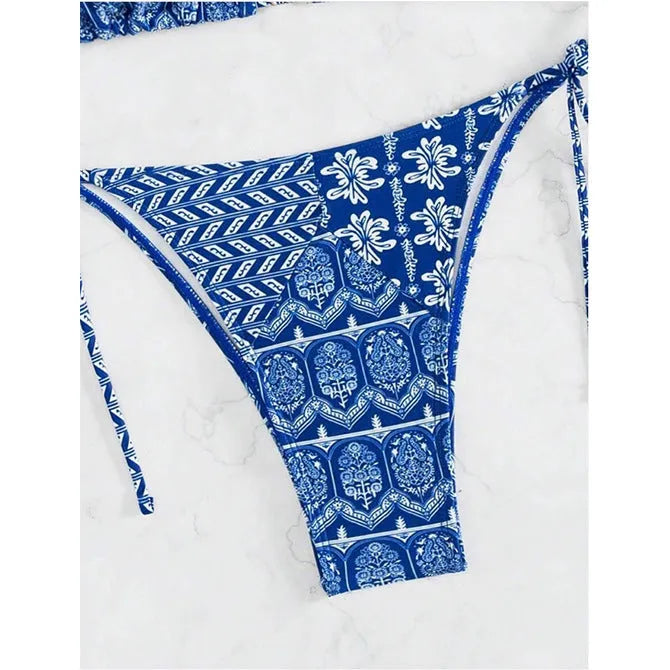 Women's green bandage style bikini with printed stitching on a briefs bottom.