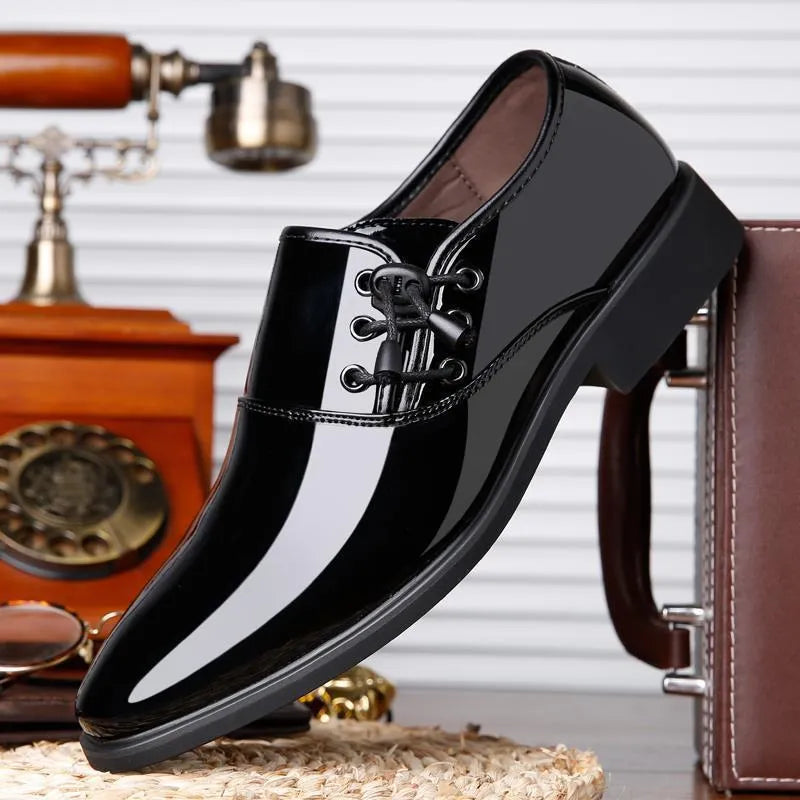 Men's black and brown formal oversleeve shoes with round toe and square heel on a rubber sole.