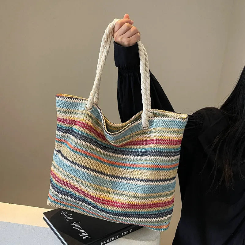 Blue woven shoulder bag with straw-effect pattern, large capacity design with single shoulder strap
