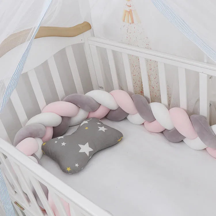 Braided knot design baby crib bumper in spandex velvet, shown in a light grey colour.