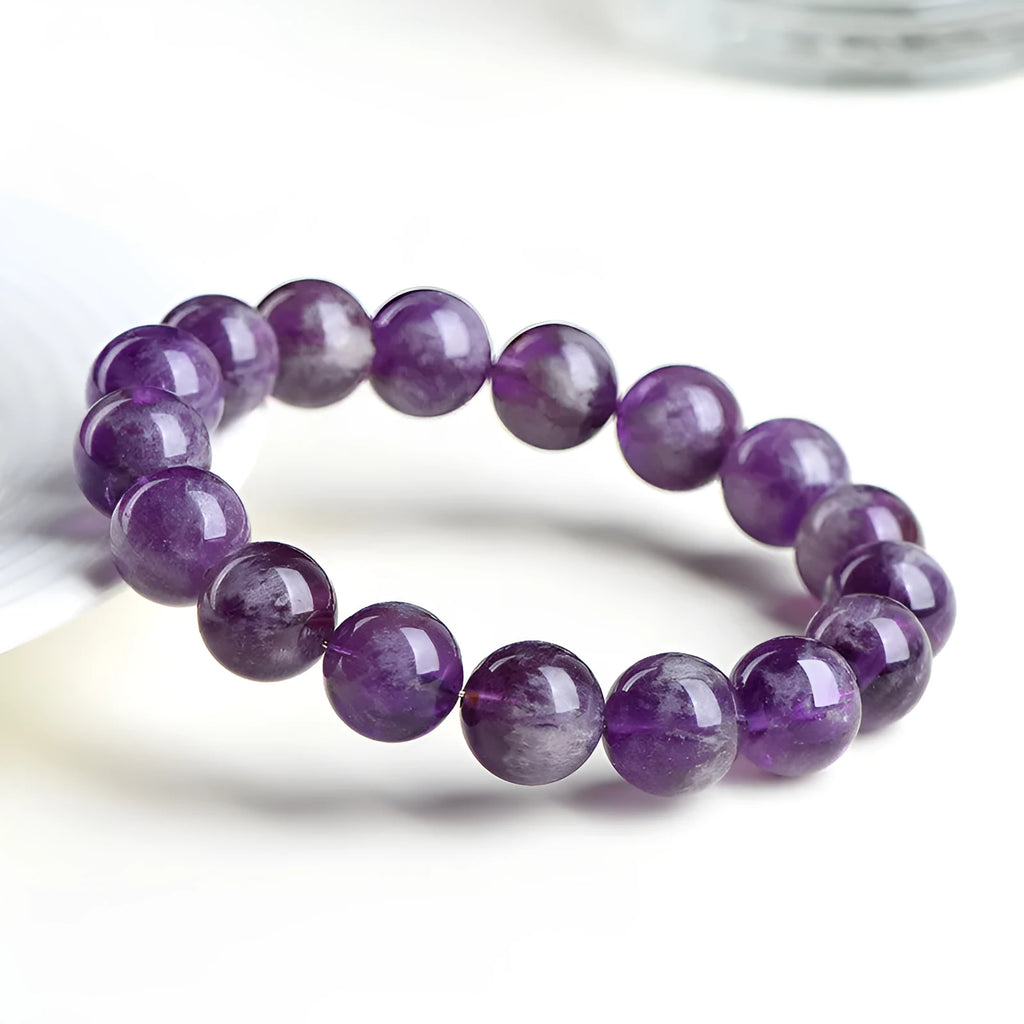 Natural feather amethyst crystal bracelet with Snow Mountain purple scattered beads and a Ruyi geometry design.