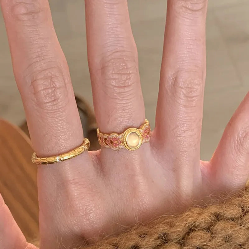 Pink crystal enamel geometric open ring on a gold plated copper band for women.