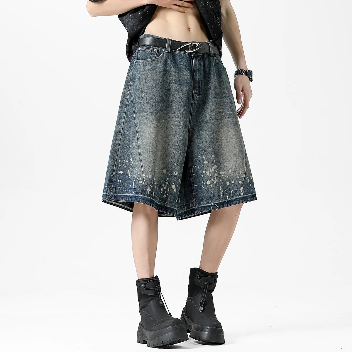 Retro blue washed denim shorts for men with ripped splash ink details and a straight leg cut.