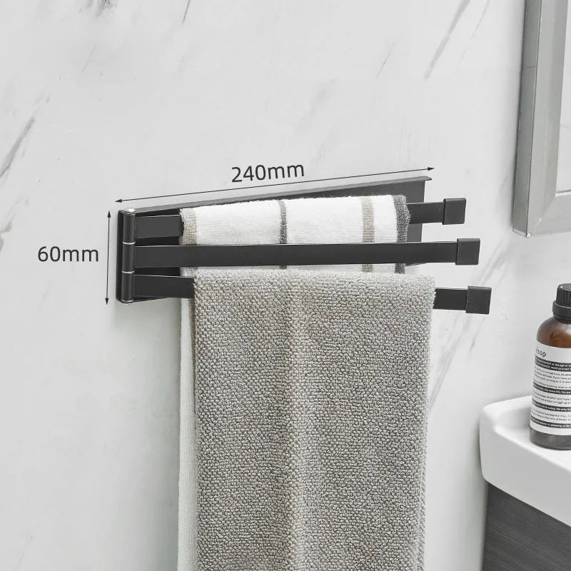 Black folding towel bar mounted on a bathroom wall with no visible screws or drill holes.