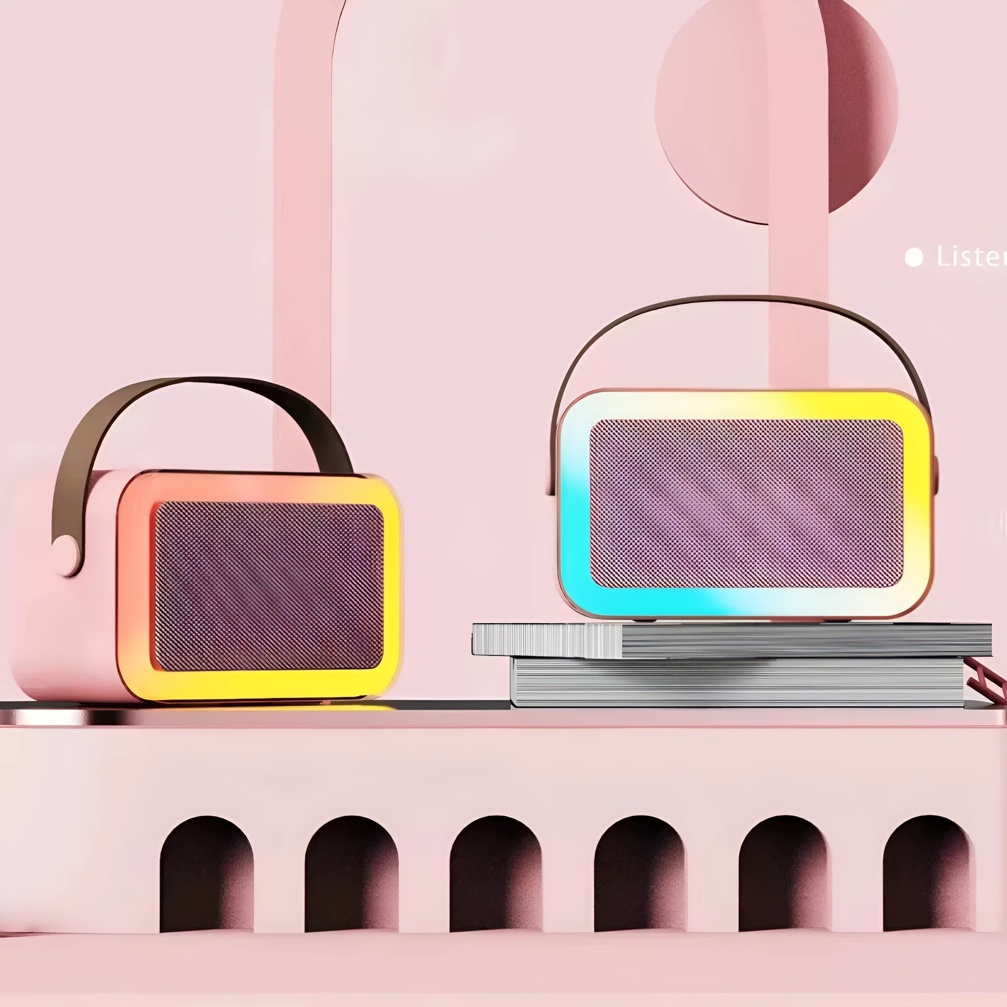 Pink portable Bluetooth karaoke speaker with coloured lights and built-in microphone on a white background.