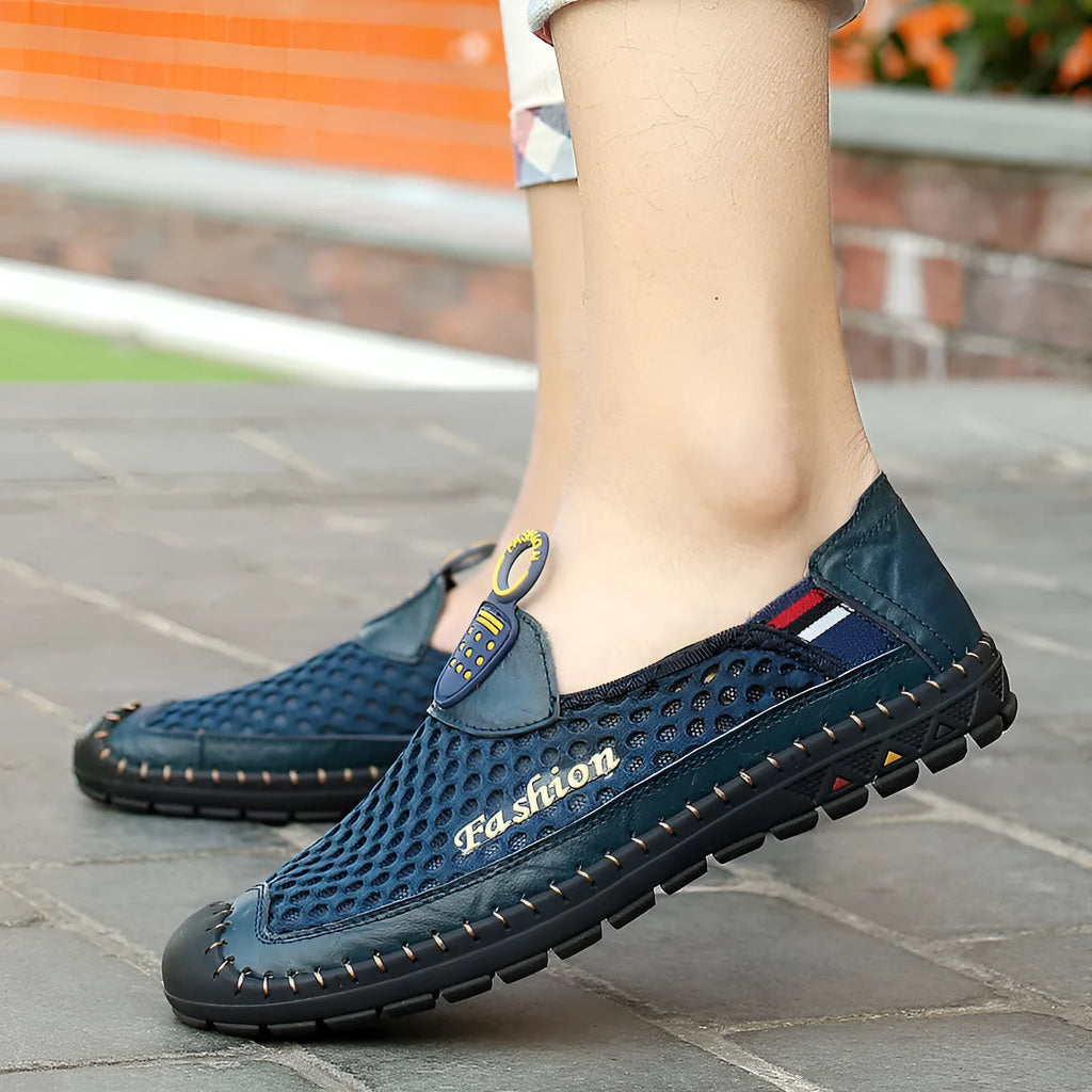 Men's brown casual mesh shoes with a round toe and stitched rubber sole on a plain background.