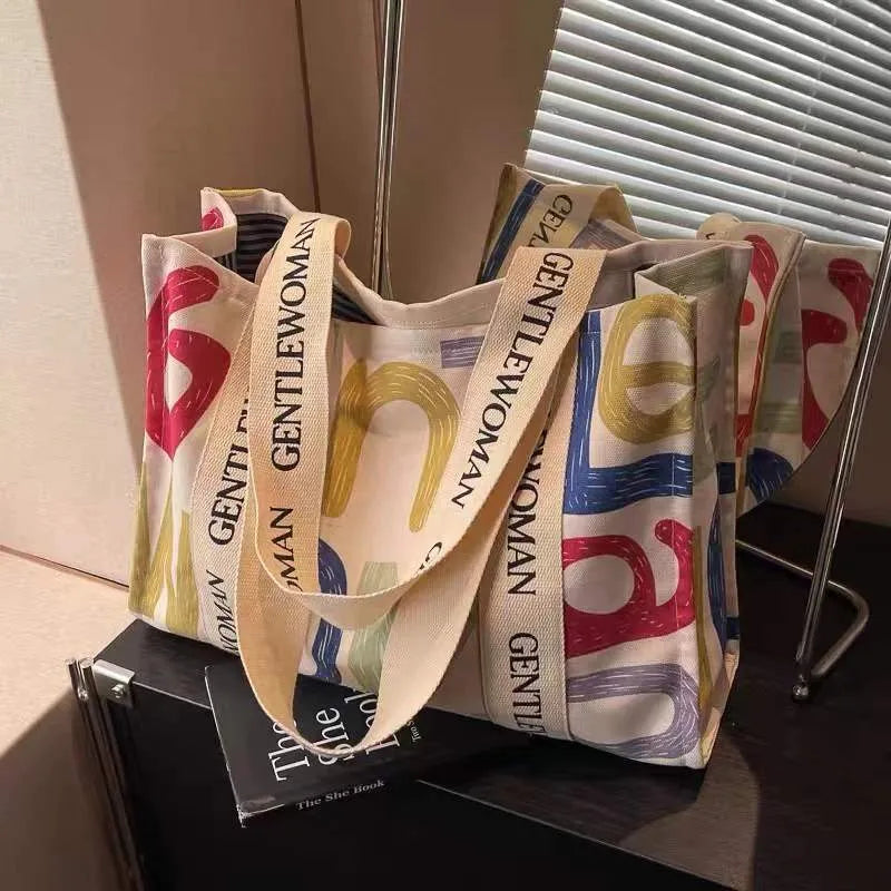 Canvas tote bag with printed design, large capacity for shopping and travel