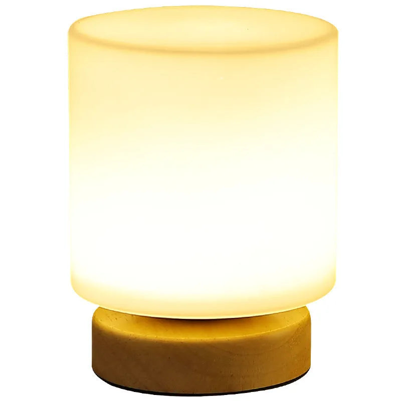 Nordic solid wood flower-shaped USB table lamp with touch dimming in a white cube style on a table