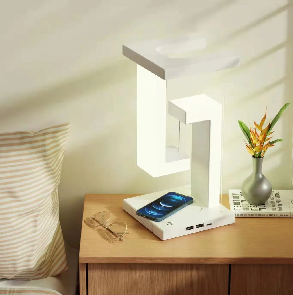 White magnetic suspension table lamp with wireless charging, touch switch, USB power, 12 x 12 x 22 cm, floating light design.