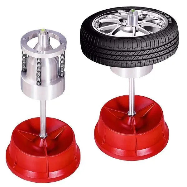 Portable aluminium hub balancer for car and truck tyres with 1.5 to 4 inch hub range on enamel-finished base.