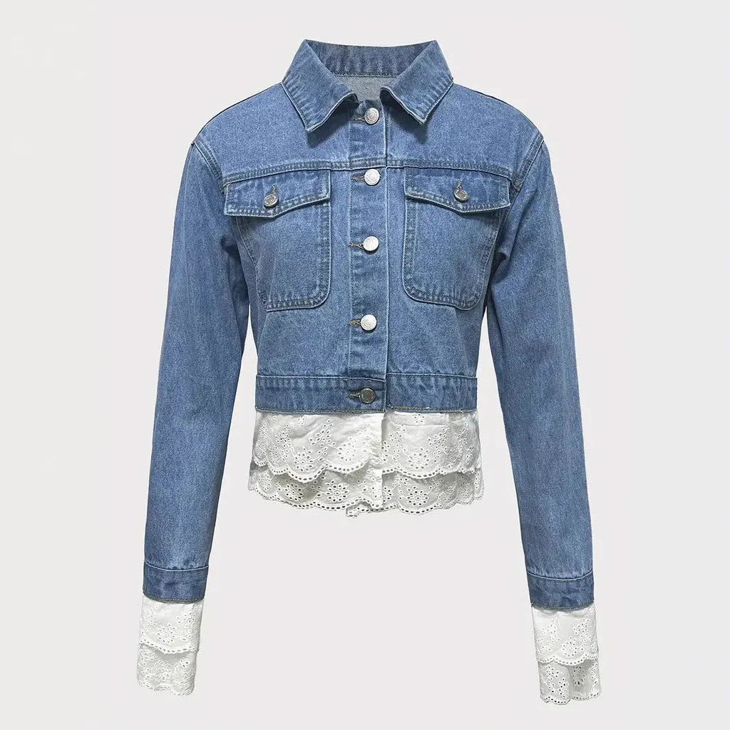 Blue women's denim jacket with lace stitching detail on front, long sleeves, shown on hanger