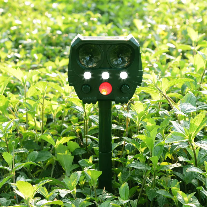 Green solar-powered ultrasonic animal repeller unit for outdoor pest control