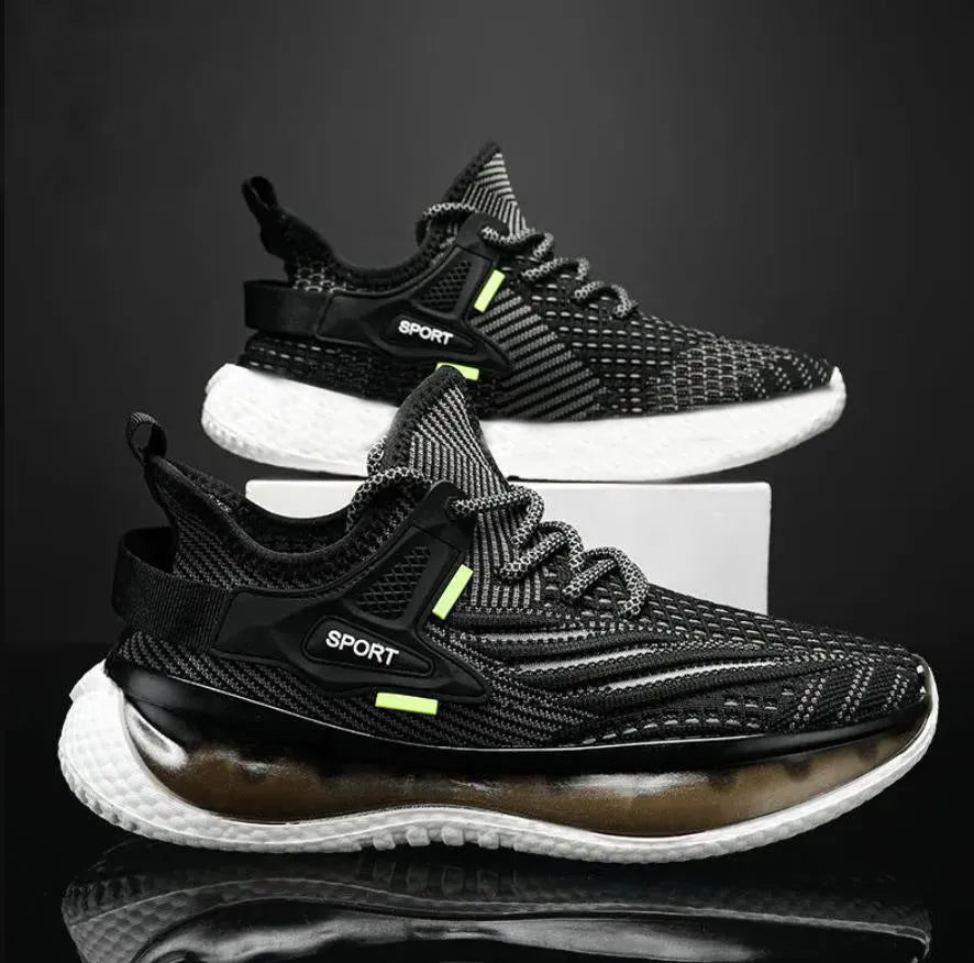 Men's low-top casual sneaker in woven mesh with a round toe and flat rubber sole.