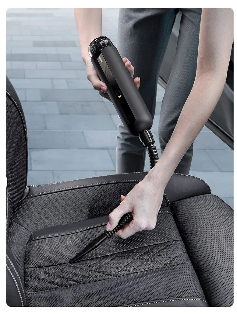 Baseus handheld cordless car vacuum cleaner in black, white, or green with blowing hose attachment.