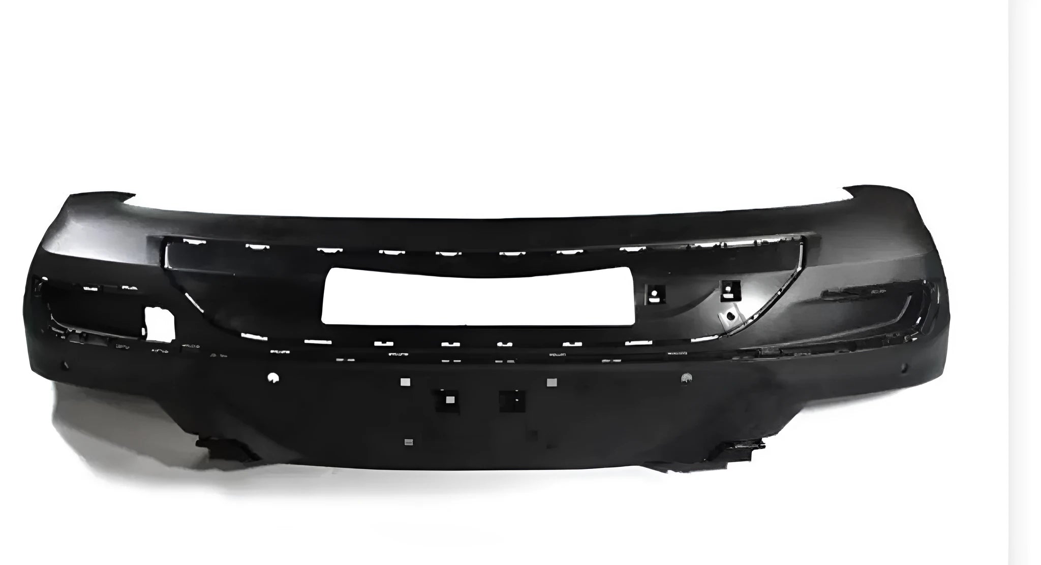 Black plastic vehicle bumper protector with rubber corner pads mounted on a garage wall.