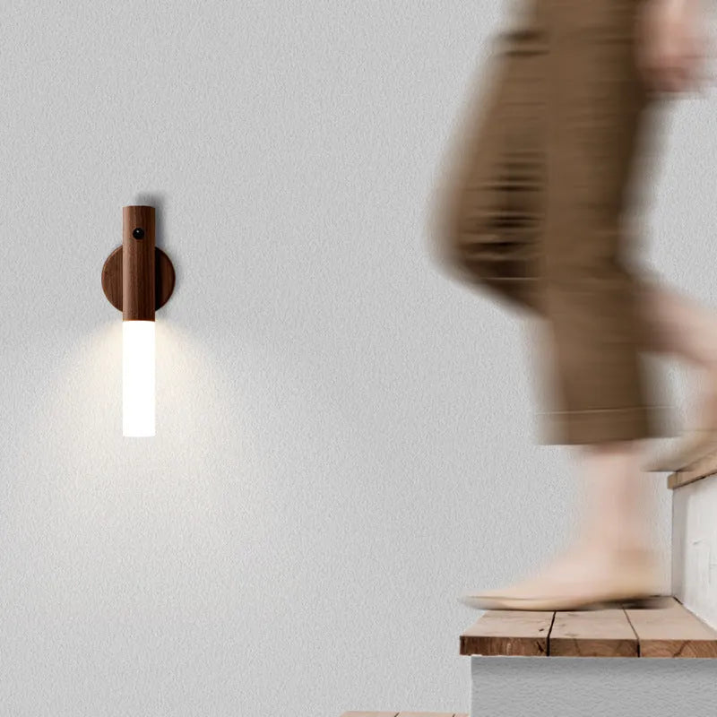 Smart sensor LED desk lamp in solid wood and acrylic on a desk, showing compact size and modern design.