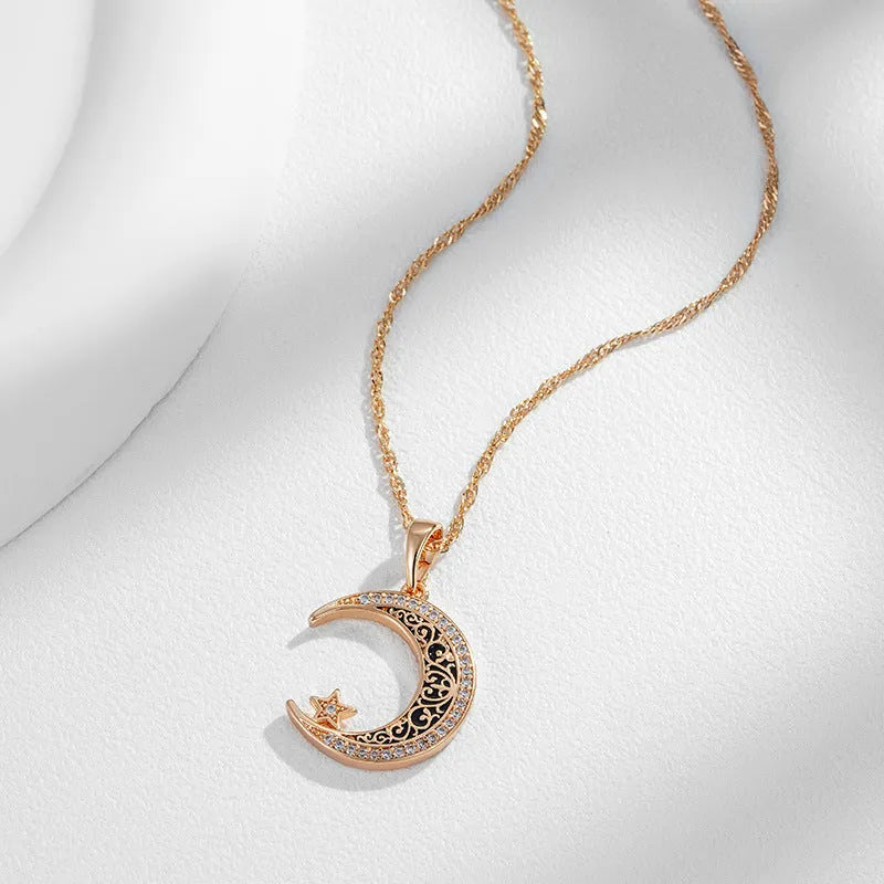 Rose gold star and moon pendant necklace with zircon stone on an adjustable water wave chain.