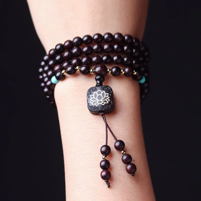 DIY kit showing 108 small 0.6 cm Zambia Rosewood beads for making a flat lotus pendant Buddha bead bracelet.