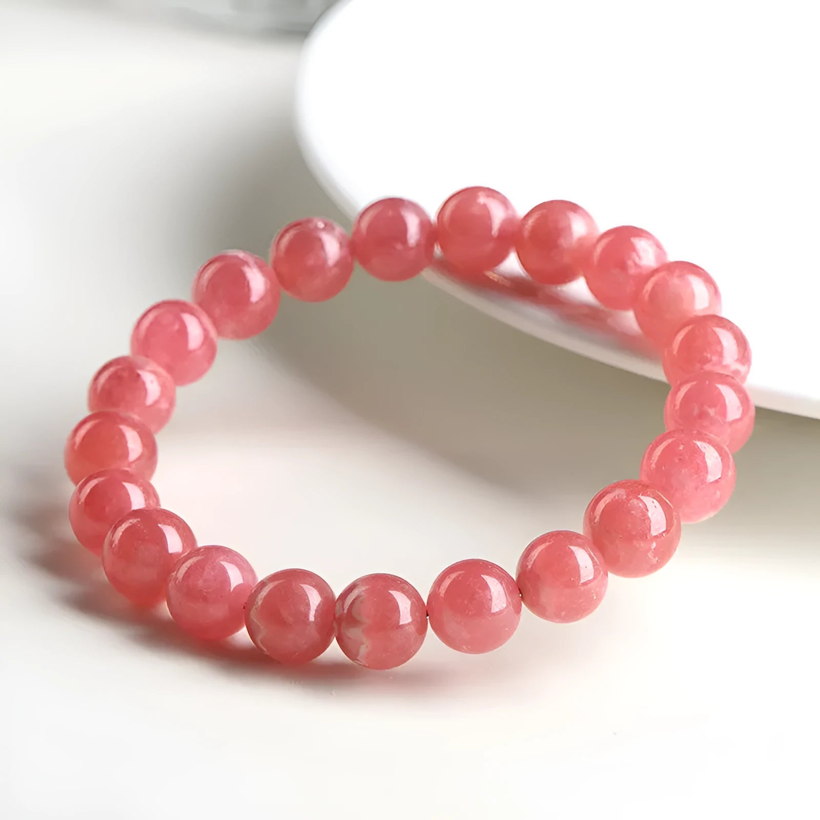 Women's crystal bracelet with geometric red stone beads and longevity lock charm