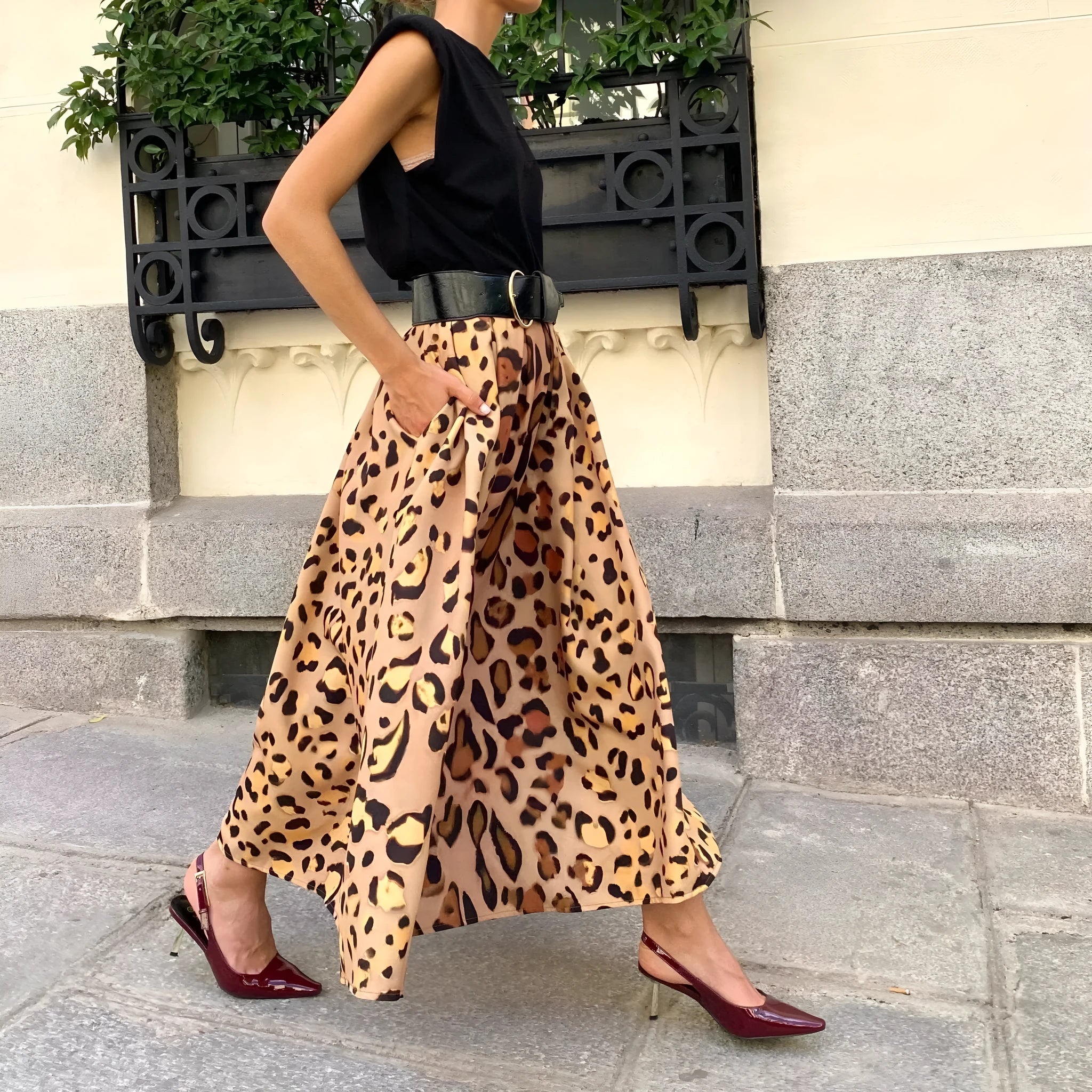 Brown leopard print women's A-line long skirt with a big hem, laid flat.
