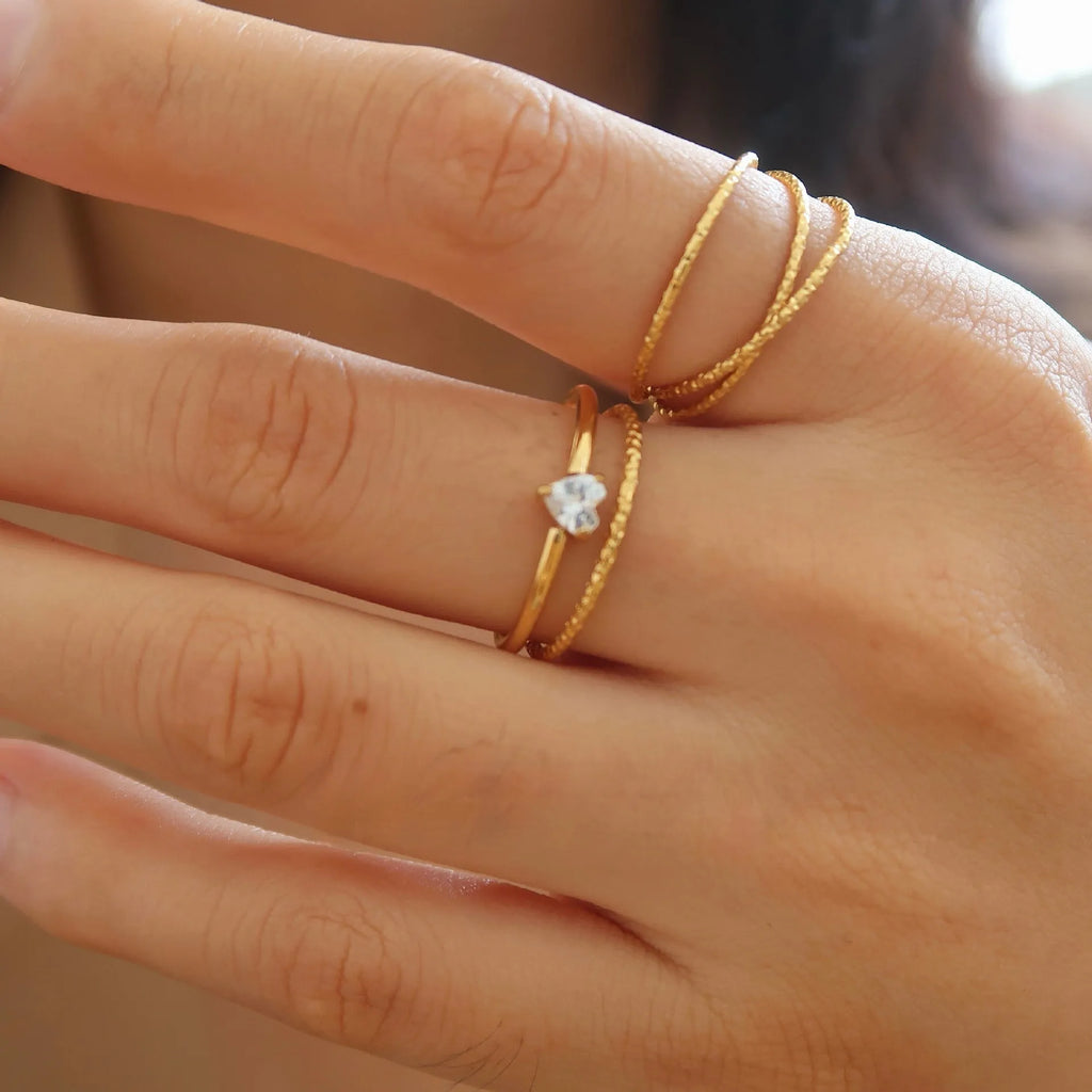 Golden heart-shaped stainless steel ring for women available in sizes 6-8