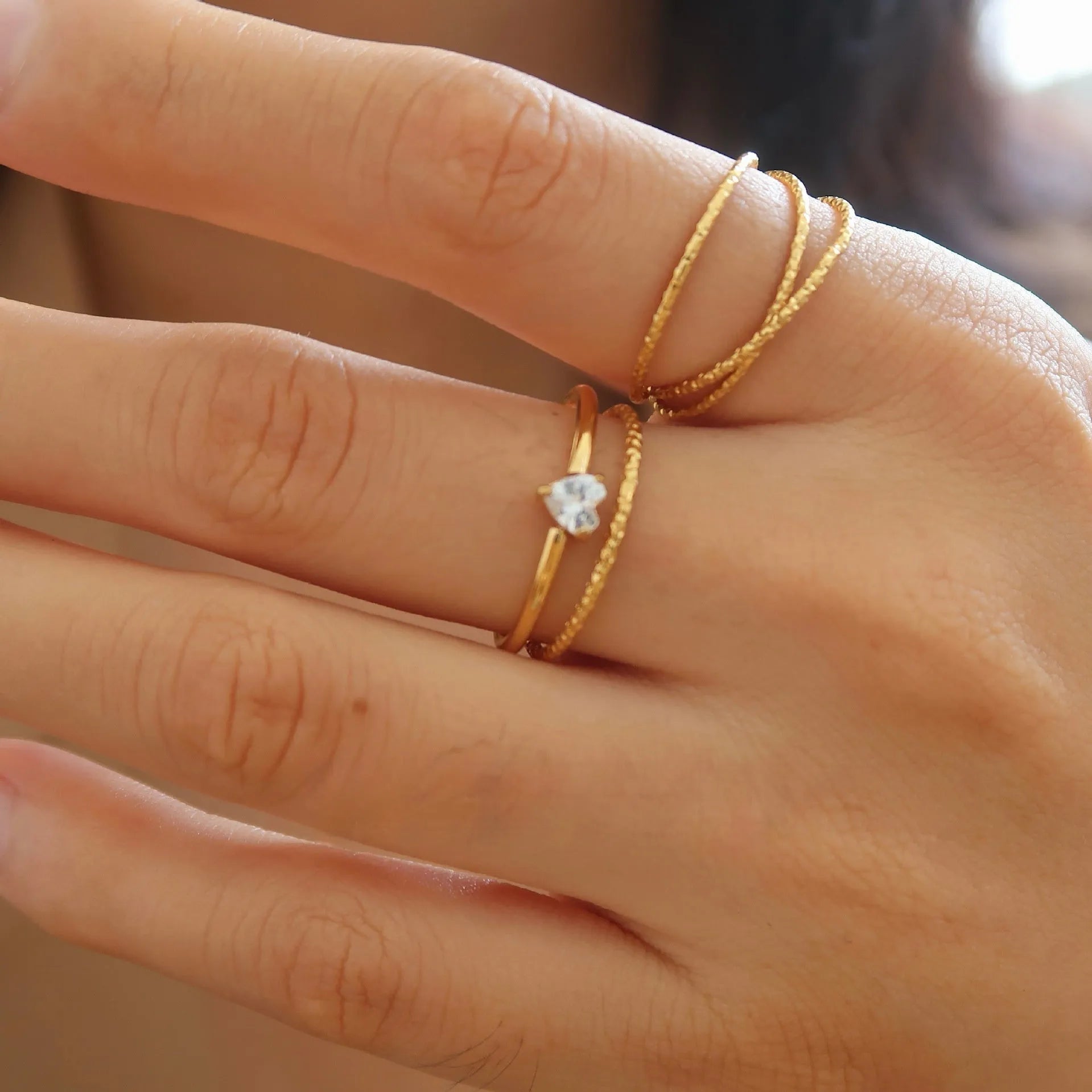 Golden heart-shaped stainless steel ring for women available in sizes 6-8