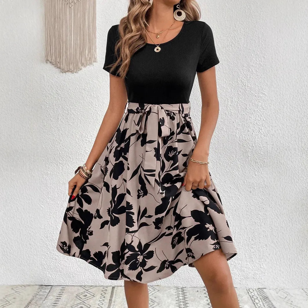 Women's khaki casual dress with A-line skirt, lace-up front detail, and regular sleeves on a mannequin.