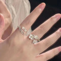 Three-dimensional flower ring with camellia elements and open mouth design in zinc alloy