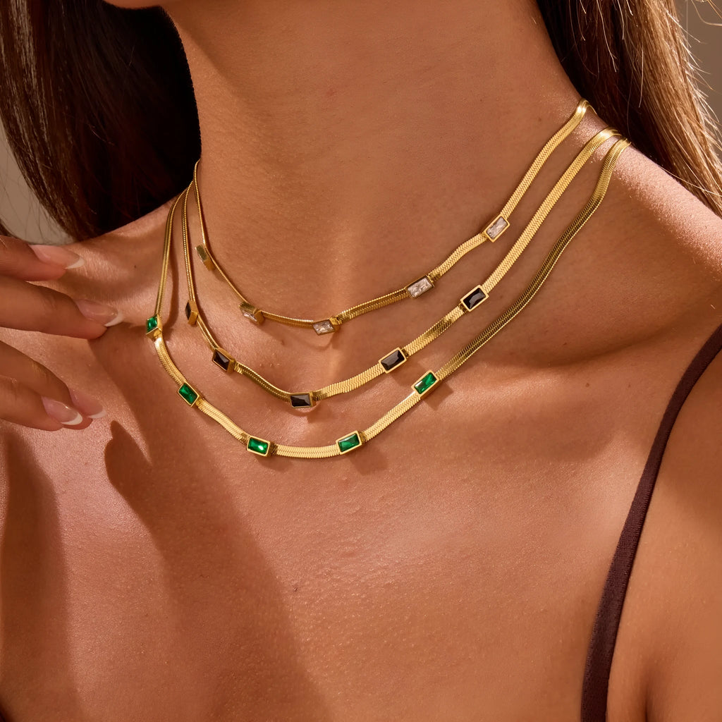 Retro geometric square zircon pendant on a stainless steel flat snake necklace chain.