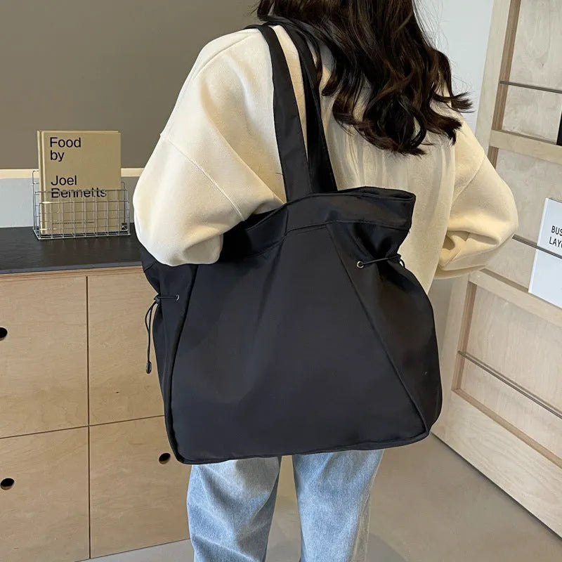 Soft folding Oxford cloth tote bag with shoulder handle in multiple colour options.