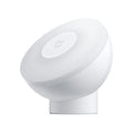 White Mijia Bluetooth bedside lamp with human body induction on a nightstand.
