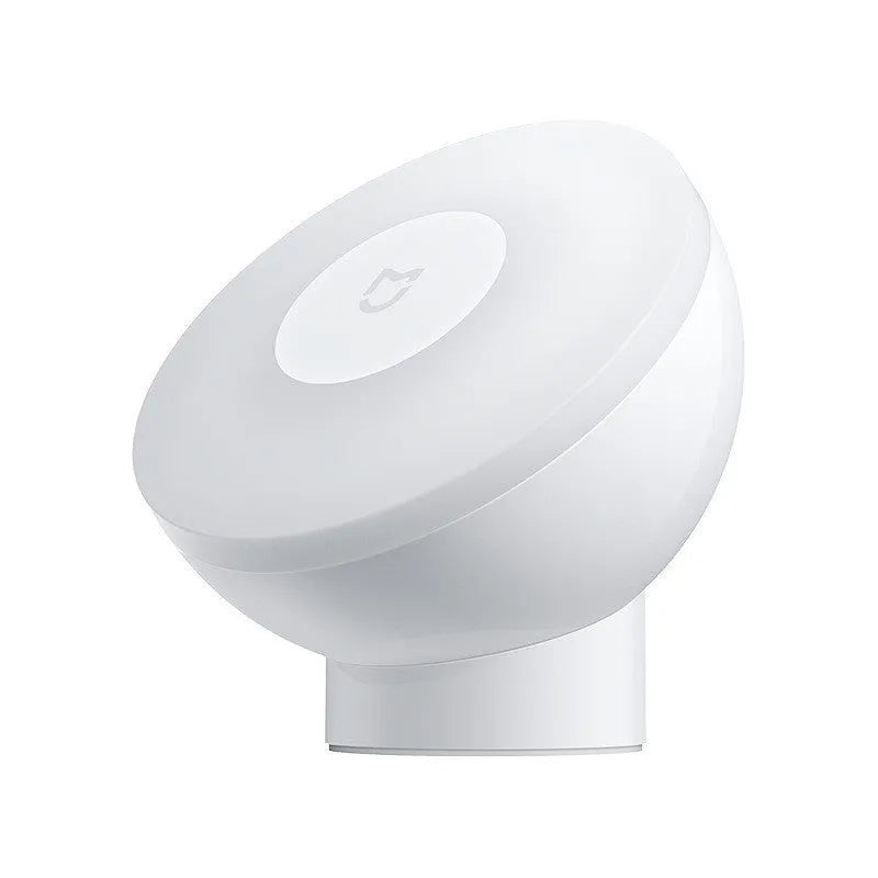 White Mijia Bluetooth bedside lamp with human body induction on a nightstand.