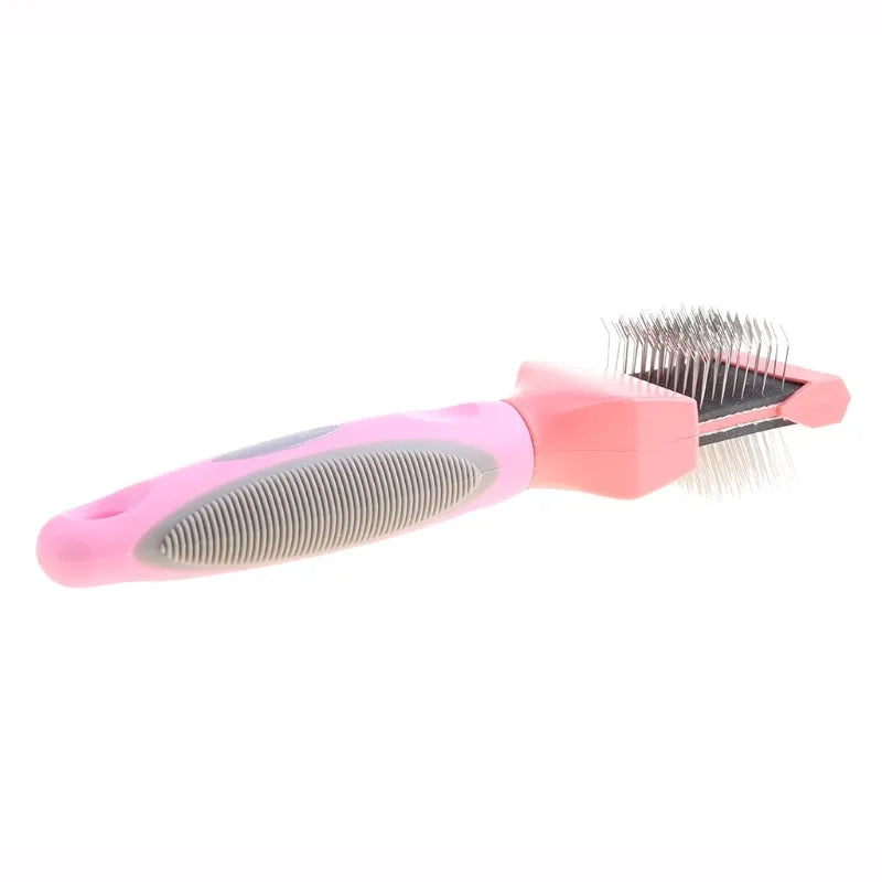 Double-sided pet grooming brush with stainless steel pins in blue or pink, showing ergonomic handle and pin details