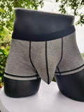 Men's solid colour boxer shorts in breathable fibre fabric on a plain background.