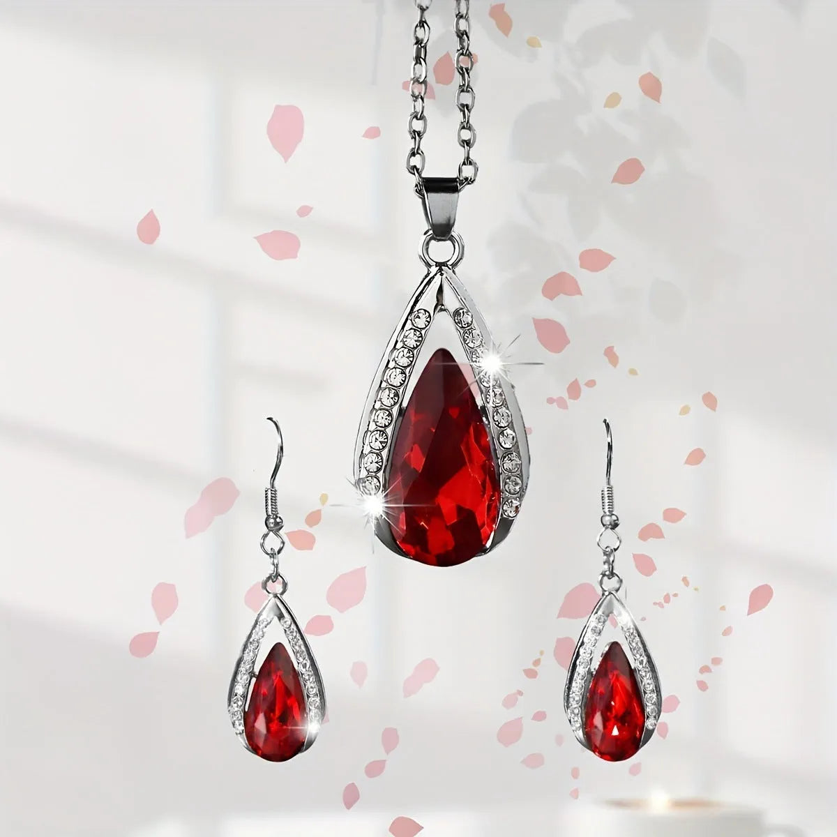 Black and red teardrop glass pendant necklace and matching earrings set with water droplet design
