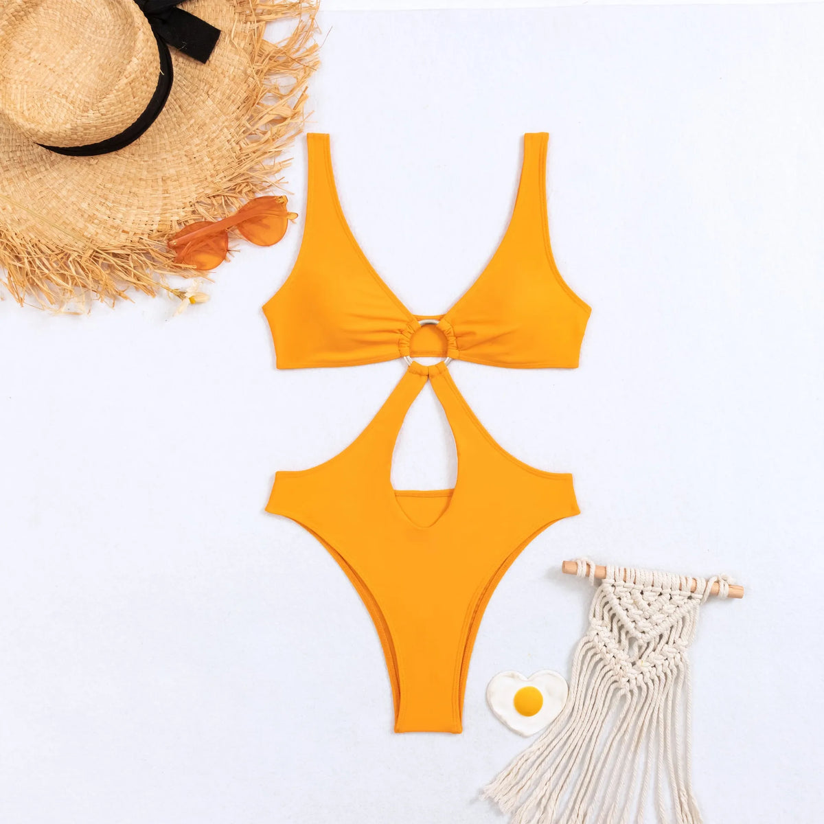 Women's black triangle one-piece sleeveless swimsuit made from nylon fabric on a mannequin.