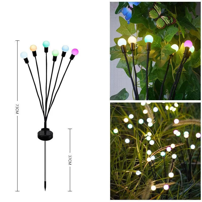 Solar-powered LED firefly ground spike light with multiple heads inserted along a garden path.