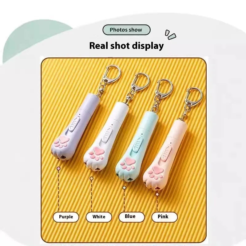 Cat teasing pen light toy with LED light in cream white, pink, or blue plastic