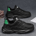 Men's solid colour breathable mesh trainers in black or white with round toe