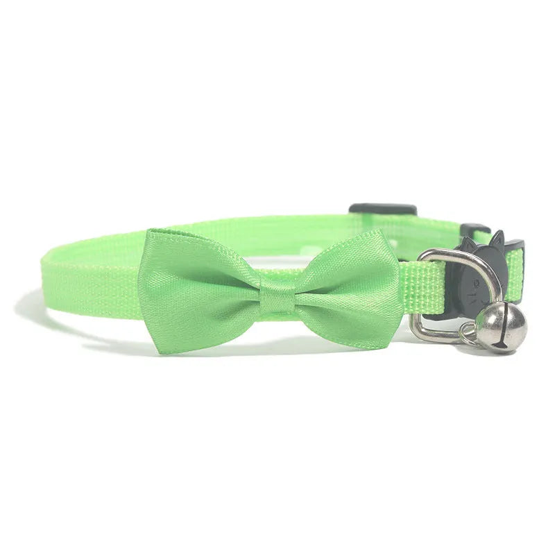 Adjustable striped nylon cat collar with bell in various colors including red, green, and blue