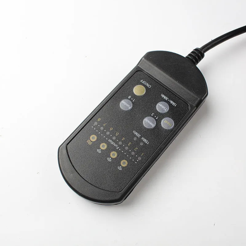 Black heating massage mat for infrared physiotherapy with power cord and seat cushion.