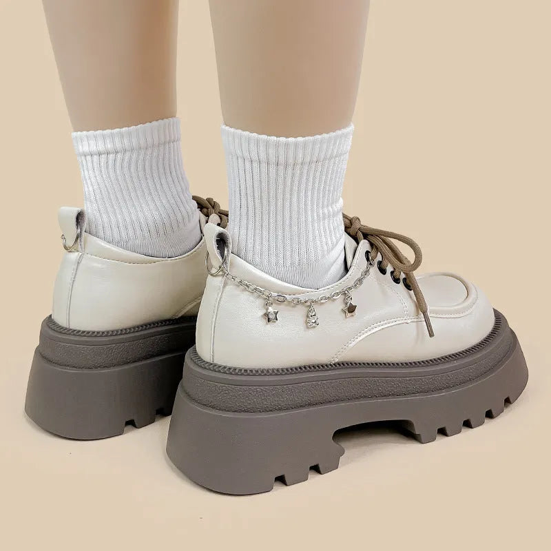 White platform Mary Jane shoes with round toe, lace-up front, and chunky 6-8cm heels