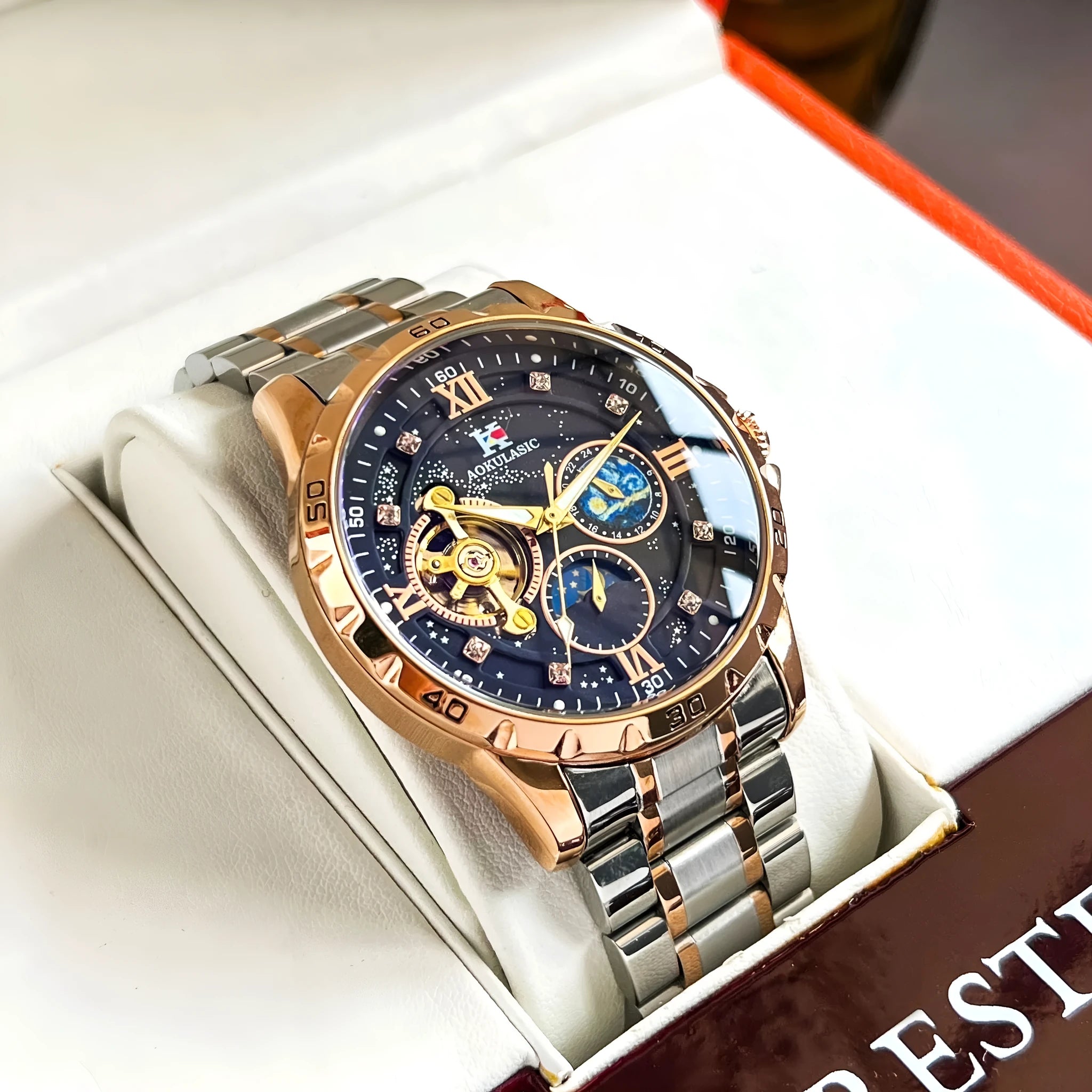 Men's automatic mechanical watch with rose gold shell case and black dial face showing 12mm thickness