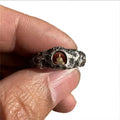 Hand-forged copper ring with rock texture featuring grotto Buddha design, shown in UK size 8