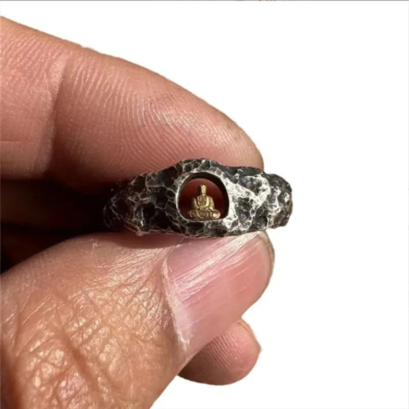 Hand-forged copper ring with rock texture featuring grotto Buddha design, shown in UK size 8