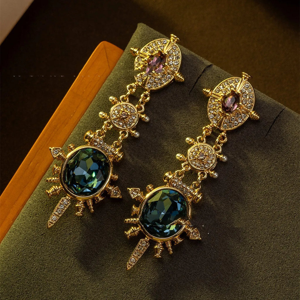 A pair of gold-coloured geometric round stud earrings with a retro style and diamond-treated alloy finish.