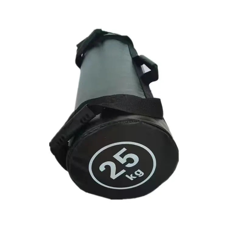 Flat white leather PVC fitness training sandbag shown in a gym setting for weight lifting and conditioning.
